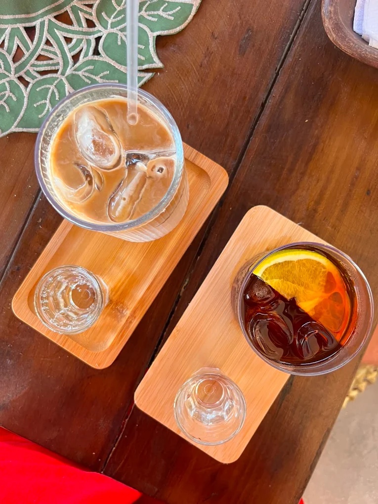 Cold drinks on wooden serving boards at the CAYA bar