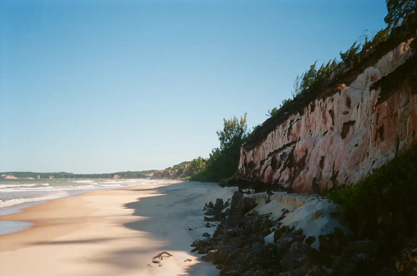 A Pipa beach below the headland cliffs